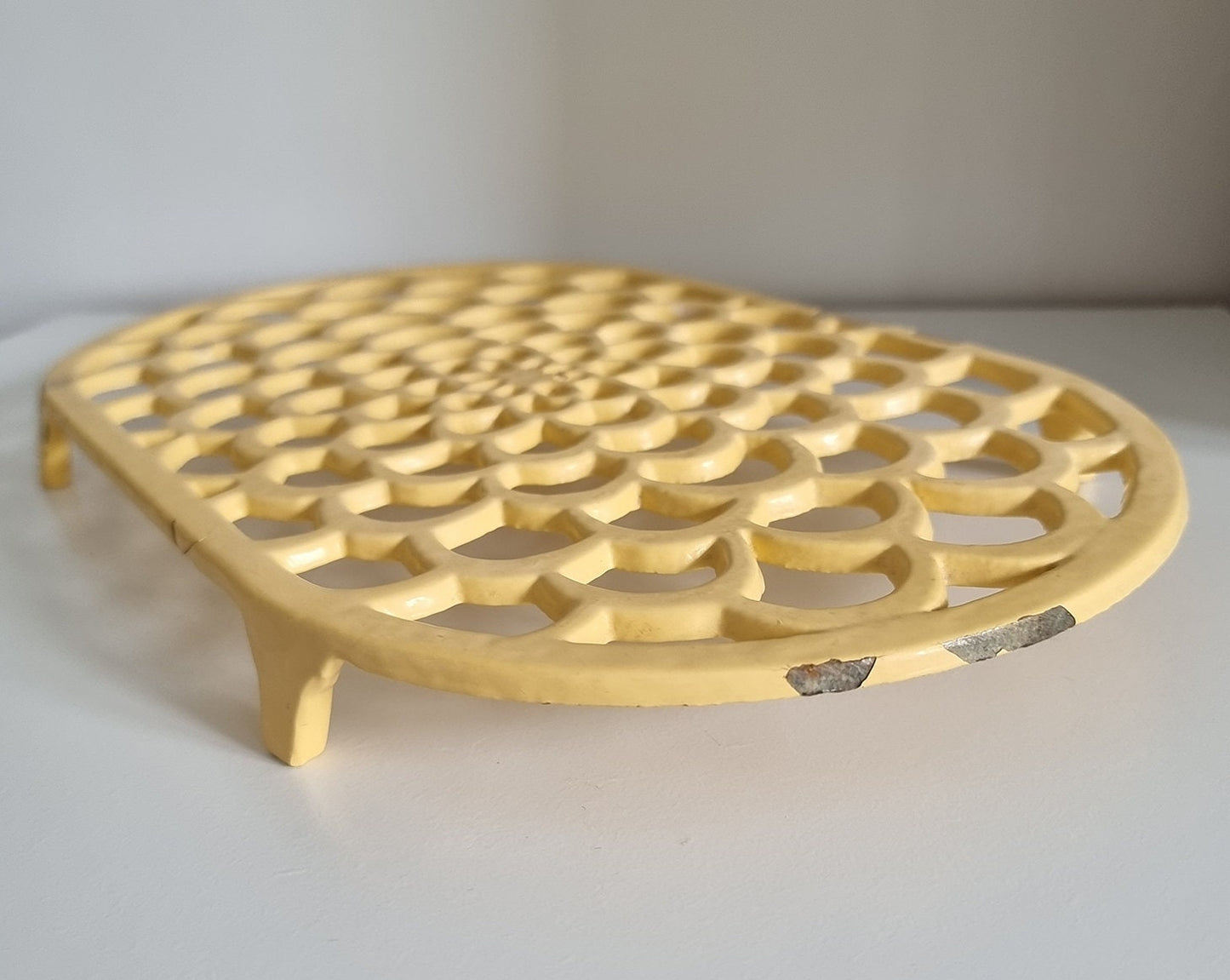 Vintage Pastel Yellow Oval Cast Iron Trivet