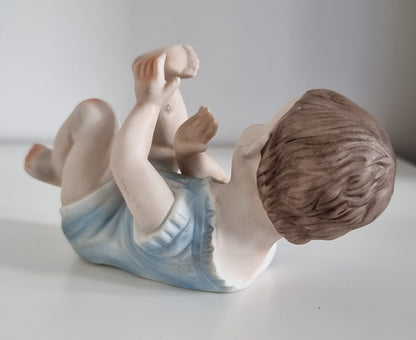 Lovely Vintage Bisque Porcelain Piano Baby Boy Figurine